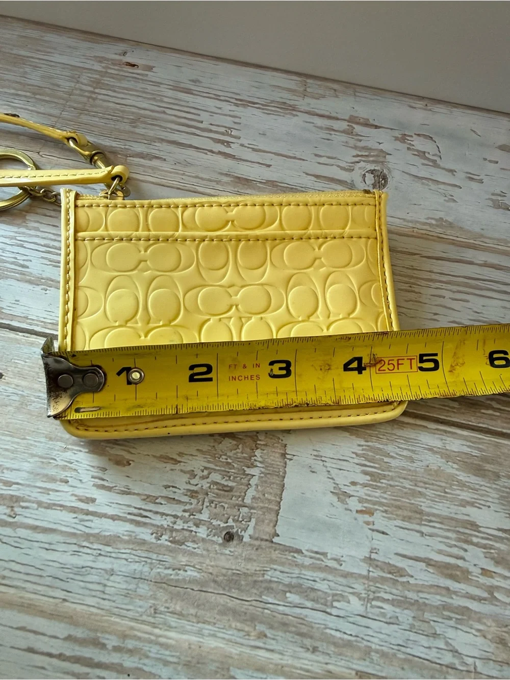 Coach wristlet Buttercup Yellow Signature Embossed Wristlet NWT
